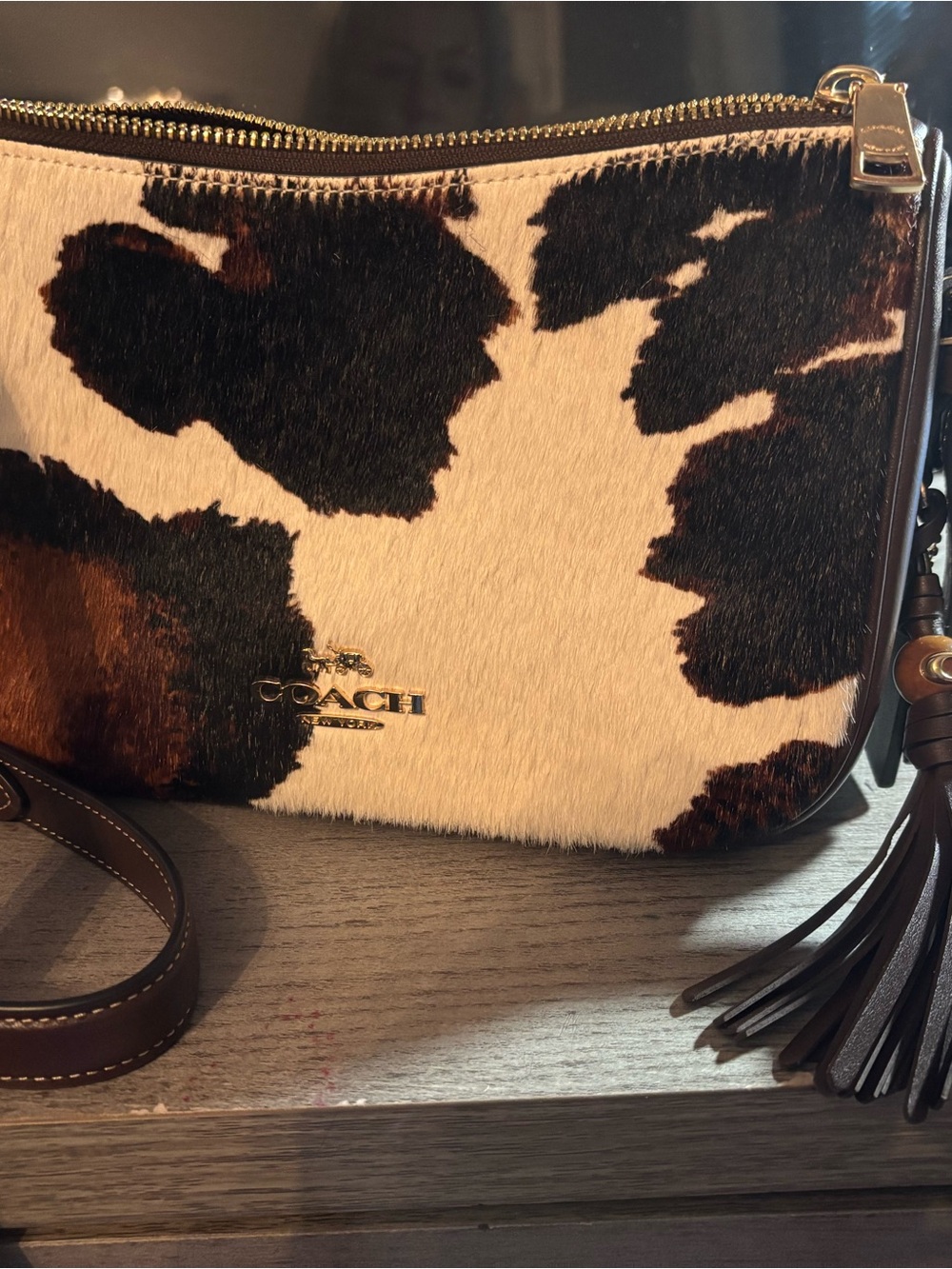 Coach Cowhide Crossbody Bag in Brown and White with Tassel